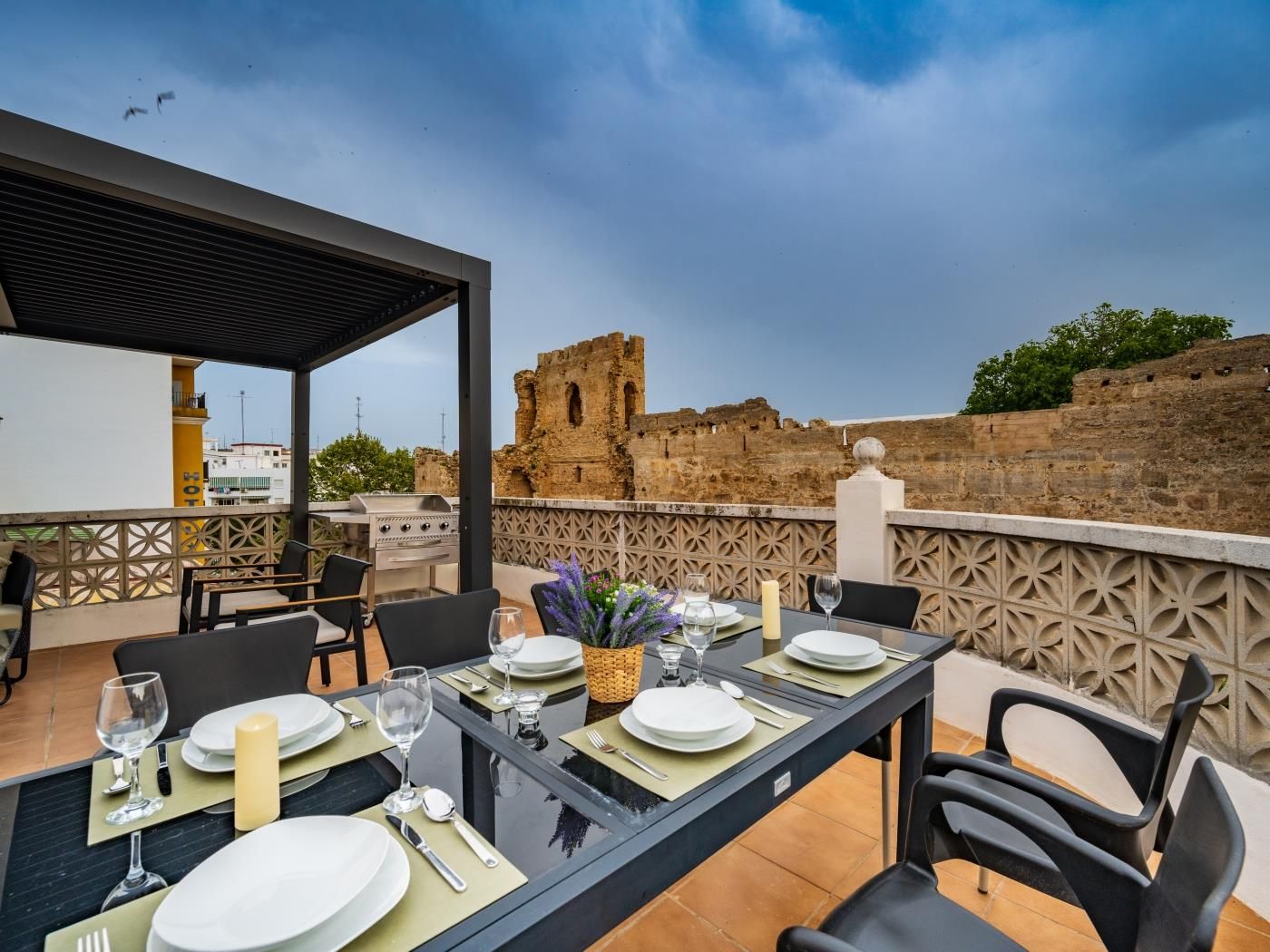 Rooftop solarium with views over Marbella’s medieval castle and fortress